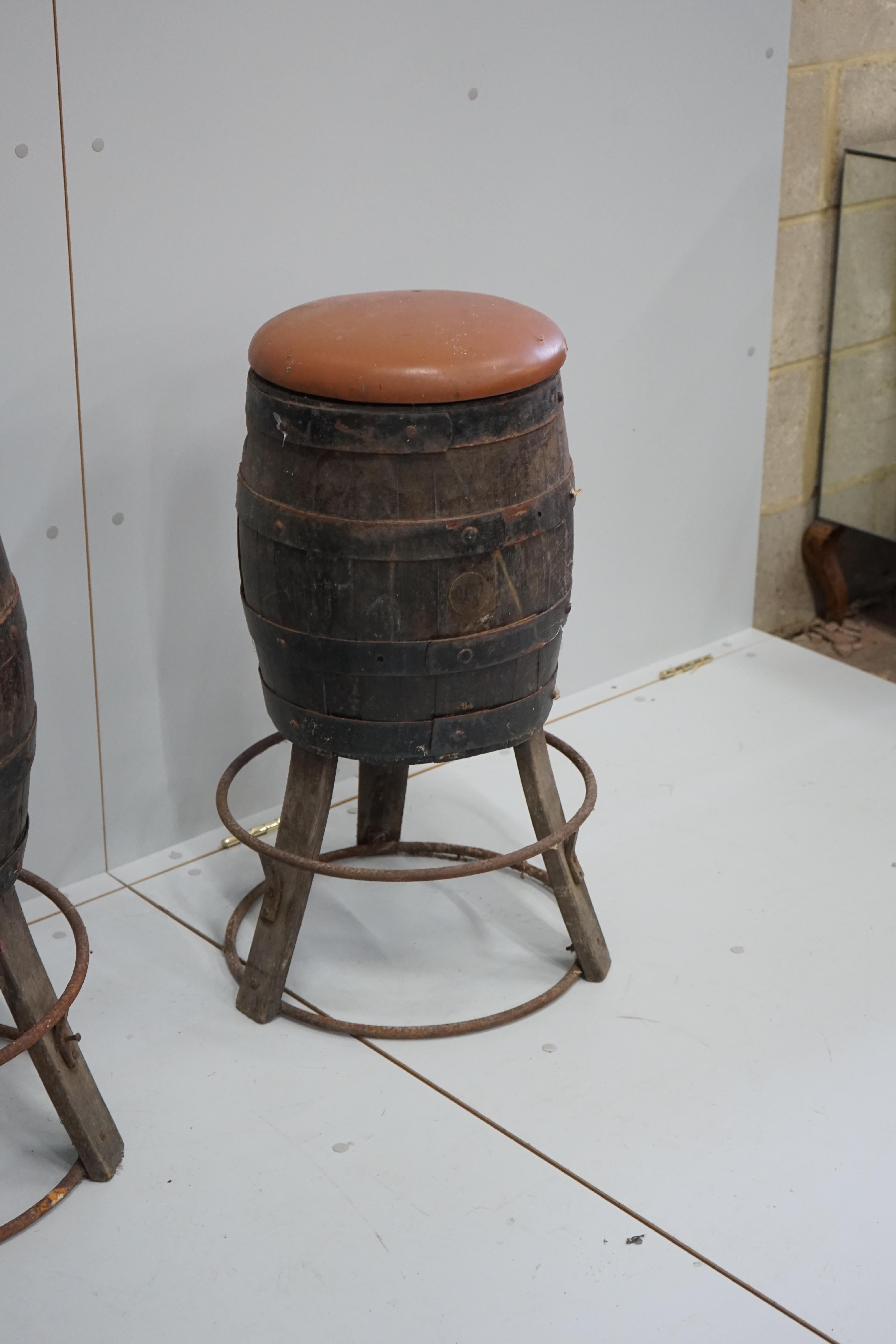 A set of four barrel bar stools, height 73cm